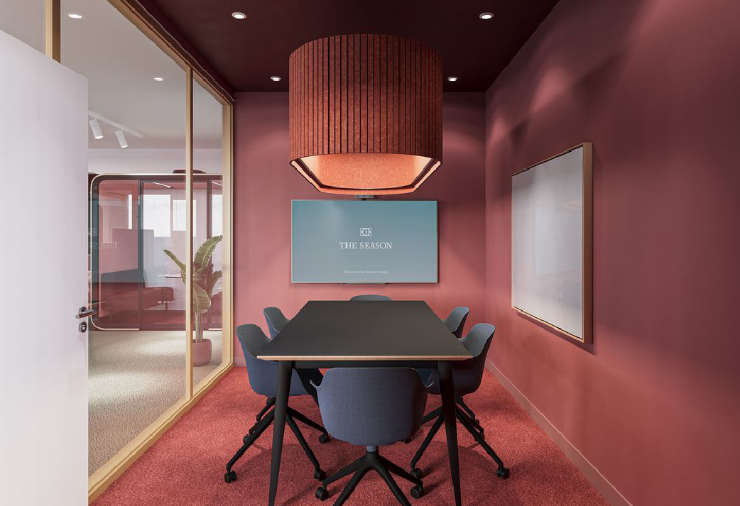 Salle de réunion du Business Lounge aux murs rouges