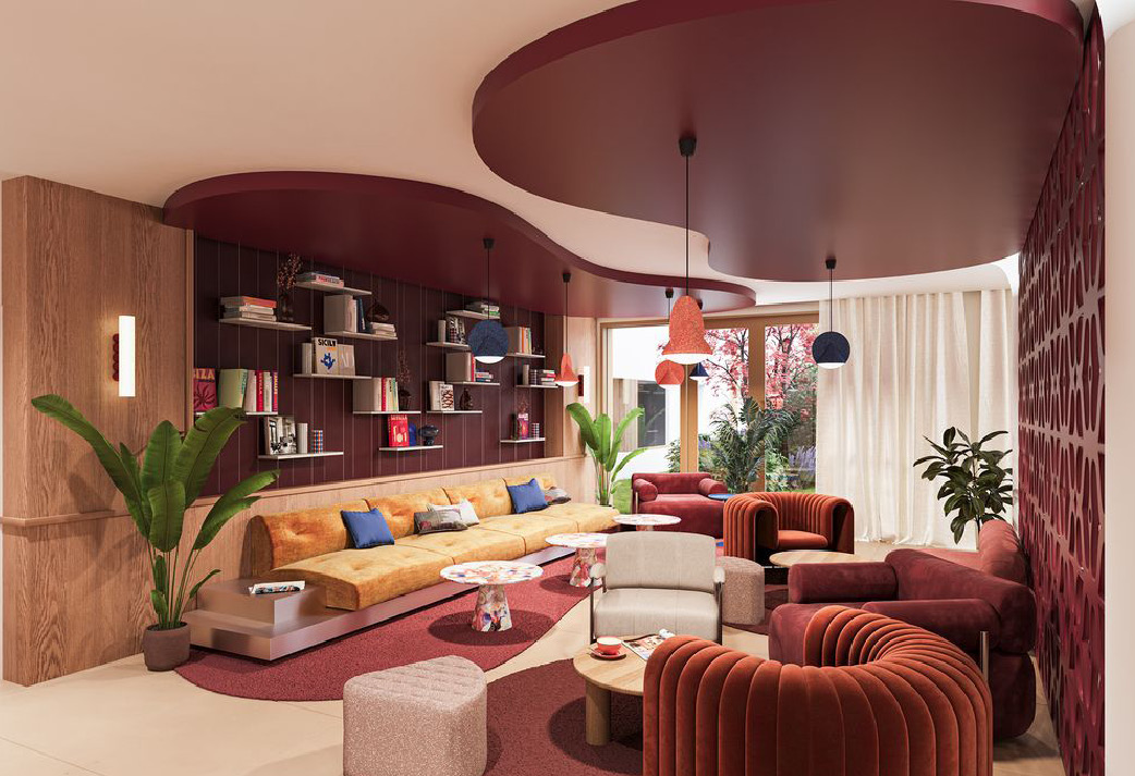Salon du Social Hub avec fauteuils et bibliothèque